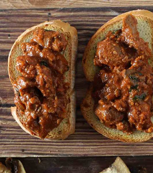 Toast with chicken livers and fried champignons