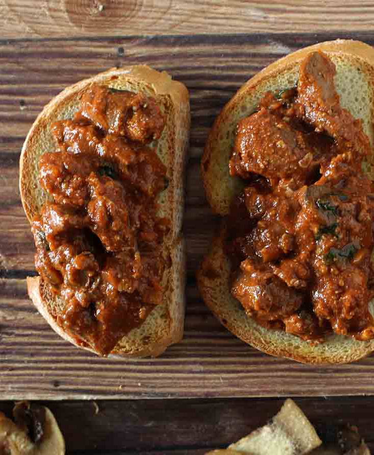 Toast with chicken livers and fried champignons