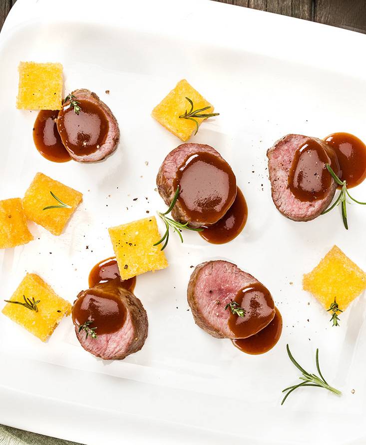 Lamb loin chops, fried polenta and tomato reduction