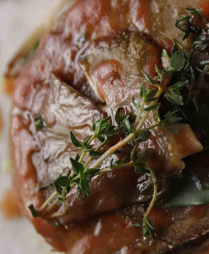 Seitan and grilled finferli mushrooms with tomato juice reduction