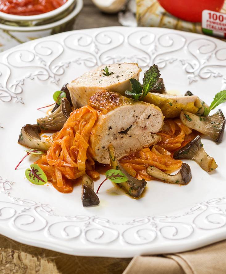 Guinea hen supreme with tomato-braised leeks and king oyster mushrooms sautéed in oil, garlic and parsley